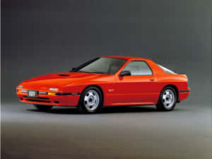 工作室中充滿活力的橙色Mazda RX7 GT跑車 — 馬自達 壁紙