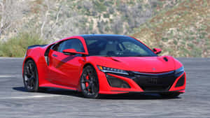 紅色跑車停在乾燥山丘附近的瀝青路上 — Acura 壁紙