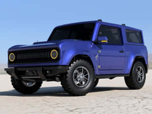 藍色福特Bronco SUV停在龜裂的沙漠地面上，天空清澈。 — 福特野馬越野車 壁紙