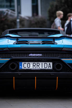 藍色藍寶堅尼Huracán Spyder，帶有橙色飾邊和'CORRIDA'車牌。 — 蘭博基尼 壁紙
