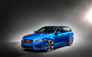 藍色Jaguar XF Sportbrake豪華性能旅行車在工作室燈光下 — Steam Deck 壁紙