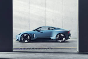 極簡混凝土車庫中的時尚藍色未來主義跑車。 — 藍色亮片 壁紙