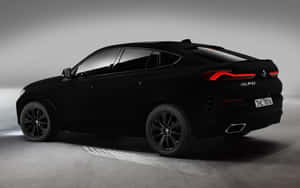 消光黑色BMW X6 SUV，紅色尾燈，攝影棚 — 雕塑 壁紙