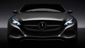 在黑暗攝影棚中，一輛黑色賓士汽車的正面視圖，車頭燈亮起。 — Mercedes Benz C300 壁紙