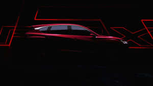 在黑暗工作室環境中，紅色SUV剪影被霓虹燈照亮。 — Acura 壁紙