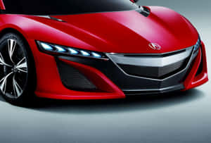 紅色跑車，藍色頭燈和黑色飾件，在工作室燈光下。 — Acura 壁紙