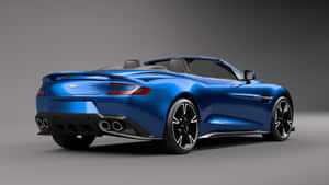 藍色Aston Martin V12 Vantage敞篷車後視圖 攝影棚 — 奧斯頓馬丁 壁紙