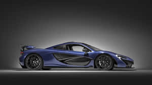 藍色McLaren超級跑車在工作室中，帶有戲劇性燈光和黑色點綴。 — 4K 法拉利 壁紙