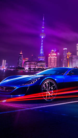 藍色跑車在霓虹閃爍的上海夜間飛馳，留下光軌。 — 4K iPhone 壁紙