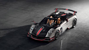 時尚的銀色帕加尼 Huayra Roadster，帶有紅色點綴和賽車號碼20，停在深色混凝土上。 — 天空景色 壁紙