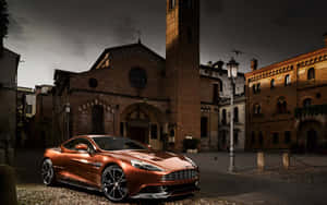 銅色Aston Martin停放在歷史悠久的義大利廣場，正值黃昏。 — Steam Deck OLED 壁紙