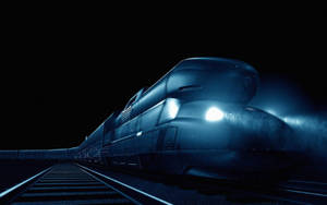 一輛高速列車帶著明亮的車頭燈在夜間穿過黑暗的隧道。 — 電玩遊戲 GIF 壁紙