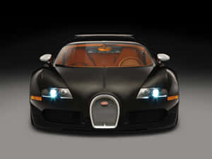 黑色Bugatti Veyron，橙色內飾和發光頭燈，在攝影棚燈光下。 — 布加迪 GIF 壁紙