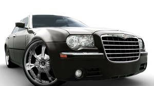 黑色Chrysler轎車，配備客製化鍍鉻輪圈，在攝影棚燈光下。 — 克萊斯勒 壁紙