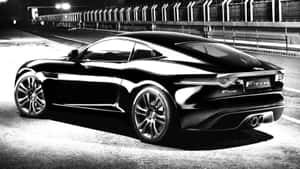 夜間賽道上的黑色Jaguar F-Type跑車。 — 跑車 壁紙