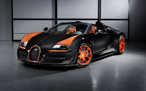 黑色和橙色Bugatti Veyron超級跑車在工作室中，帶有戲劇性的燈光。 — 布加迪 GIF 壁紙