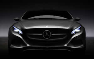 黑色梅賽德斯-奔馳汽車在黑暗工作室中亮著車頭燈的前視圖。 — Mercedes Benz C300 壁紙