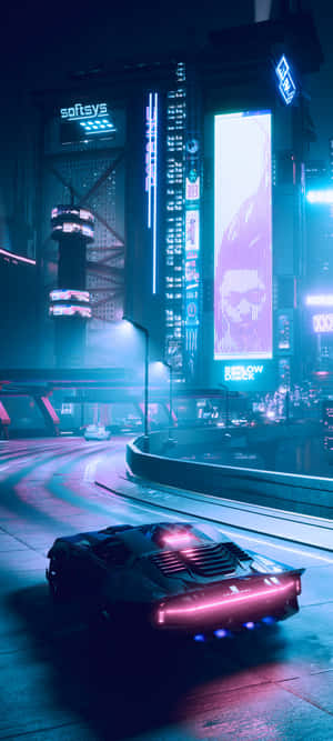 未來主義汽車在夜晚行駛於霓虹燈照亮的賽博龐克城市。 — Pixel 11 壁紙