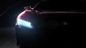 在黑暗的攝影棚環境中，紅色跑車車頭燈亮起 — Acura 壁紙