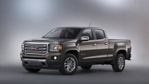 工作室燈光下的時尚棕色GMC Canyon皮卡車 — Gmc 壁紙
