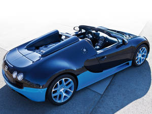 藍黑 Bugatti Veyron Super Sport 敞篷車停在混凝土上。 — Bugatti iPhone 壁紙