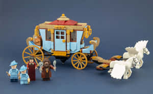 藍色背景上的LEGO驛馬車、馬匹和迷你人偶 — 霍格華茲 GIF 壁紙
