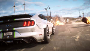 白色Mustang GT在道路上高速行駛，背景有爆炸和風力發電機。 — 電玩遊戲 GIF 壁紙