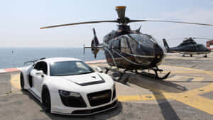 白色跑車和黑色直升機在海邊直升機停機坪上。 — 藍天 壁紙