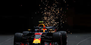 紅牛F1賽車在夜間疾馳，後輪火花四濺。 — 馬克斯·維斯塔潘 壁紙