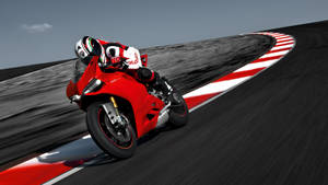 紅色Ducati摩托車在彎曲賽道上奔馳，車手傾斜入彎。 — 杜卡迪 GIF 壁紙