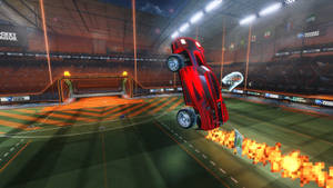 紅色汽車在Rocket League競技場中翻轉，帶像素火焰 — 4K 火箭聯盟 壁紙