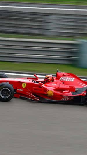 紅色法拉利F1賽車在賽道上奔馳，背景模糊。 — 4K 法拉利 壁紙