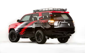 訂製紅黑配色豐田 4Runner TRD SUV，配備車頂行李架和醒目貼紙。 — Toyota Supra Mk4 壁紙