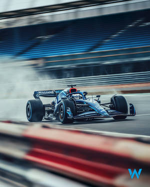 藍色威廉斯F1賽車在賽道上疾馳，帶有動態模糊和輪胎煙霧。 — 運動 壁紙
