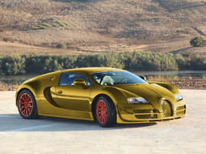 金色Bugatti Veyron配紅色輪胎，日落時停在河流附近。 — 山脈 壁紙