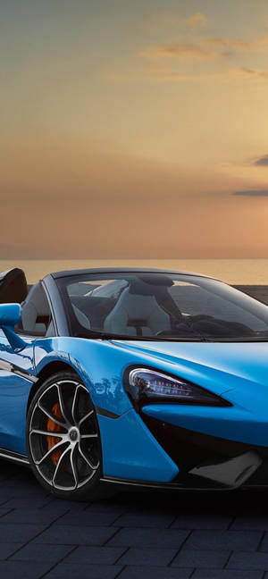 藍色McLaren跑車停泊在日落碼頭海洋景觀 — 日落 壁紙
