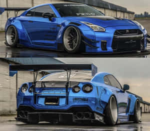 藍色改裝日產GT-R，配備寬體套件和大尾翼，停泊在潮濕路面上。 — 日產 壁紙