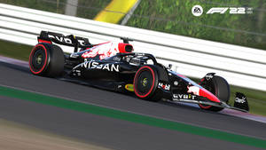 黑紅色的日產F1賽車在賽道上奔馳，帶有動態模糊效果。 — 日產 壁紙