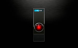 拉絲金屬背景上帶有紅色眼睛和藍色標籤的HAL 9000電腦 — 機器人 壁紙