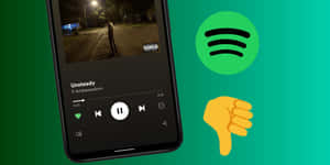 Spotify 應用程式在綠色背景上顯示帶有拇指向下表情符號的歌曲。 — Spotify 壁紙