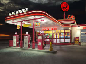 復古加油站，Route 66標誌在黃昏時發光。 — 瓦斯 壁紙