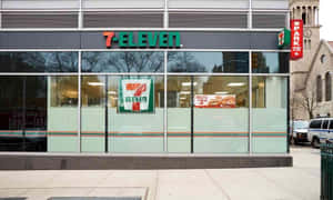 7-Eleven便利商店，玻璃窗，背景是歷史悠久的教堂。 — 7-ELEVEN 壁紙