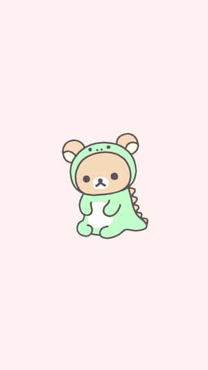 一隻卡通熊在粉紅色背景上穿著綠色恐龍服裝。 — 可愛動物動圖 壁紙