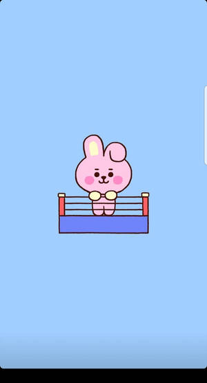 粉紅色卡通兔子在藍色背景的拳擊場上。 — 廚奇 BT21 壁紙