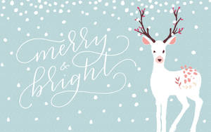 白鹿帶粉紅鹿角及花卉斑點在雪景中，附 merry bright 文字。 — 十二月 壁紙