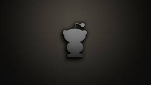 深色背景上的灰色熊圖標，戴著聖誕帽 — Reddit 壁紙