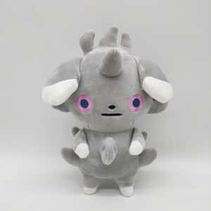 一隻灰色的 Pokémon 鐵甲犀牛毛絨玩具，擁有粉紅色眼睛和白色點綴。 — 艾斯卡諾 壁紙