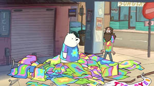 卡通熊穿紮染襯衫，旁邊一堆毯子在行人路上。 — 熊熊遇見你 GIF 壁紙