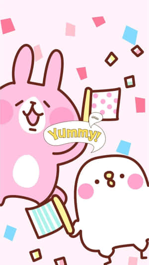 兩個可愛的卡通角色用五彩紙屑和yummy對話框慶祝。 — 可愛的動漫角色 壁紙