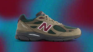 米色New Balance 990運動鞋，帶有栗色標誌，在彩色漸變背景上。 — New Balance 壁紙
